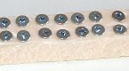 Screws fixed on a piece of polystyrene foam for painting